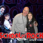 My dad and I in front of the big poster in the lobby