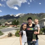 Me, auntie Charron, and Silas, in front of Charron's home