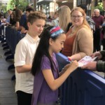 My friend Blake and I signing autographs.